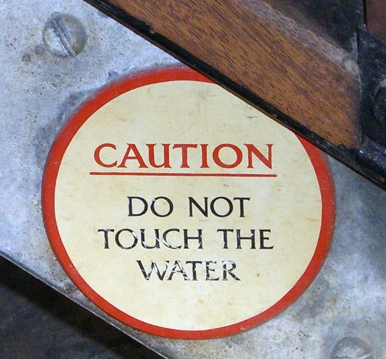 Do not touch the water sign